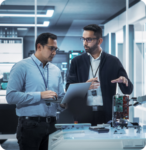 two men working on technology components